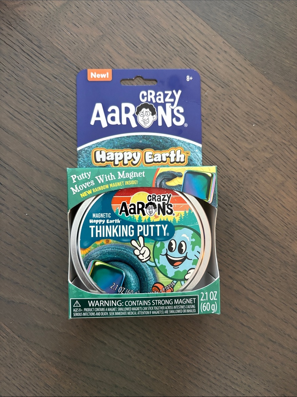 Crazy Aaron's Happy Earth Thinking Putty Rainbow magnet inside